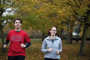 two people jogging in a park