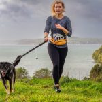 Person running with dog on a lead