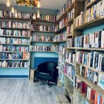 Book shelves with a comfy chair inside the reading room.