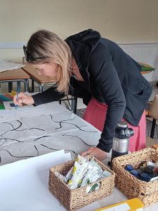 A person in the middle of creating art