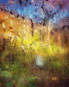 Rain on a window, blurring the view