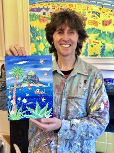 Artist John Dyer holding up his artwork