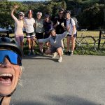 A few people smiling and posing for the photo